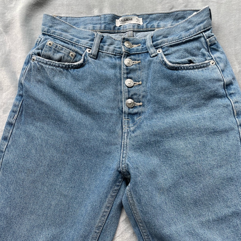 Pull & Bear cropped style mom jeans with front buttons.